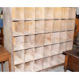 A school shoe rack with 35 pigeon holes. 67'' wide