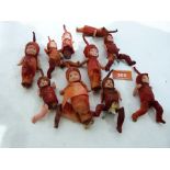 A collection of nine miniature celluloid dolls