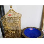 A wirework birdcage and a brass mounted Moroccan bowl