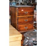 A pair of pine three drawer bedside chests