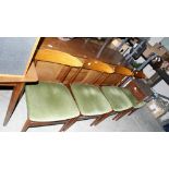 A 1970's 'retro' dining suite to comprise an extending table, four chairs and a sideboard