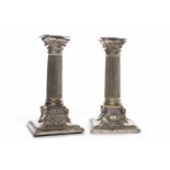 PAIR OF VICTORIAN SILVER PLATED CORINTHIAN COLUMN CANDLESTICKS over square bases embossed with
