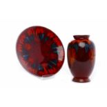 POOLE POTTERY FLAMBE VASE AND CHARGER the vase of oviform, with mottled glaze predominantly in red,