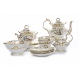 19TH CENTURY TEA SERVICE OF ROCKINGHAM DESIGN to comprise a teapot, cream jug,