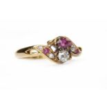 DIAMOND AND RUBY DRESS RING set with a principal round brilliant cut diamond and ruby,