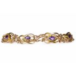 EDWARDIAN AMETHYST SET BRACELET unmarked and formed by openwork sinuous links,