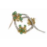 DIAMOND AND EMERALD SPRAY BROOCH set with graduated round brilliant cut diamonds and pear shaped