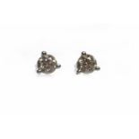 PAIR OF DIAMOND STUD EARRINGS each set with a single diamond of approximately 0.