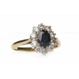 SAPPHIRE AND DIAMOND CLUSTER RING set with a central oval sapphire surrounded by round brilliant