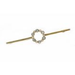 EDWARDIAN FIFTEEN CARAT GOLD PEARL AND GEM SET BAR BROOCH with an open circular section formed by