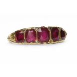 FIVE STONE RUBY AND DIAMOND RING the graduated rubies on an unmarked band, size K,