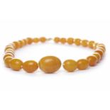 CERTIFICATED NATURAL BUTTERSCOTCH AMBER BEAD NECKLACE formed by graduated oval beads,