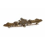 VICTORIAN FOURTEEN CARAT GOLD BAR BROOCH set with a single diamond, 4.7mm long, 2.