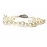 CULTURED PEARL NECKLACE formed by graduated pearls, the clasp marked 935 for silver, 45cm long, 15.