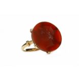 CARVED HARDSTONE RING the hardstone of circular form and carved to depict a classical gentleman in