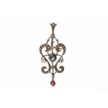 TWO EDWARDIAN PENDANTS both openwork and of sinuous form, one set with a single opal,