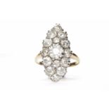 LATE VICTORIAN DIAMOND RING the marquise shaped bezel 24x13mm and set with a central old round