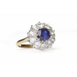 IMPRESSIVE SAPPHIRE AND DIAMOND CLUSTER RING the central sapphire of approximately 1.