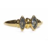 EIGHTEEN CARAT GOLD GEM SET RING with two marquise shaped blue gems, misshapen band,