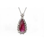 RUBY AND DIAMOND PENDANT ON CHAIN the pendant with central pear shaped ruby of approximately 2.