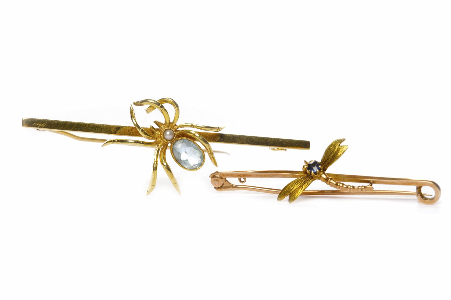 EDWARDIAN FIFTEEN CARAT GOLD SPIDER BROOCH formed by a pearl and an aquamarine set spider on a bar