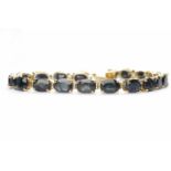 SAPPHIRE SET BRACELET set with twenty oval sapphires of approximately 0.