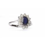 SAPPHIRE AND DIAMOND CLUSTER RING the central oval sapphire of approximately 0.