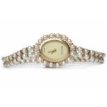 LADY'S GOLD BEUCHE GIROD PEARL SET NINE CARAT GOLD QUARTZ COCKTAIL WATCH the oval dial lacking