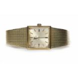 LADIES FOURTEEN CARAT GOLD OMEGA MANUAL WIND WRIST WATCH the square champagne coloured dial with