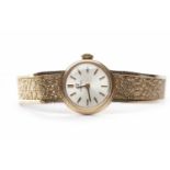 LADY'S OMEGA NINE CARAT GOLD MANUAL WIND WRIST WATCH the round dial with applied baton hour markers,