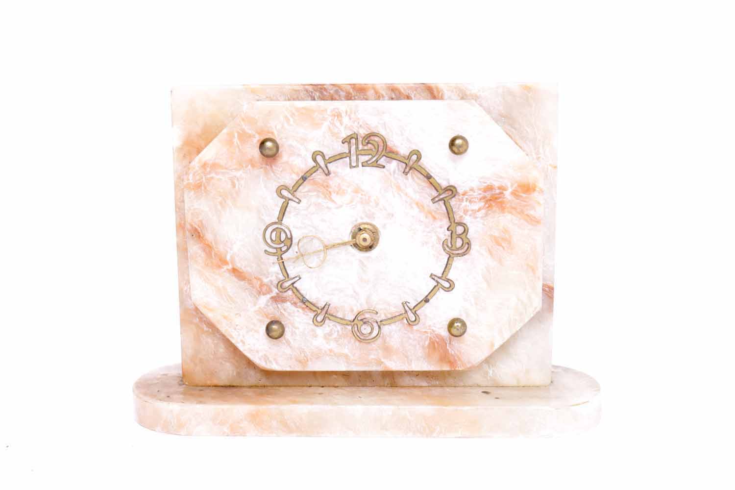 ART DECO ONYX MANTEL CLOCK with gilt Arabic and baton numeral chapter ring on a shaped rectangular