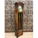 EDWARDIAN OAK LONGCASE CLOCK the 11 inch circular silvered dial with Arabic numerals and steel