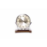 SMALL CIRCULAR MANTEL CLOCK OF ART DECO DESIGN the dial with Arabic numerals contained in a