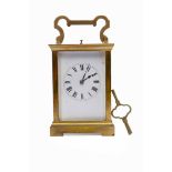 EARLY 20TH CENTURY BRASS CASED REPEATING CARRIAGE CLOCK the enamel dial with Roman numerals,