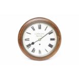 LATE VICTORIAN MAHOGANY CASED CIRCULAR WALL CLOCK the painted dial with Roman numerals and signed