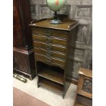 EDWARDIAN MAHOGANY MUSIC CABINET with five long drawers, two open recesses below,