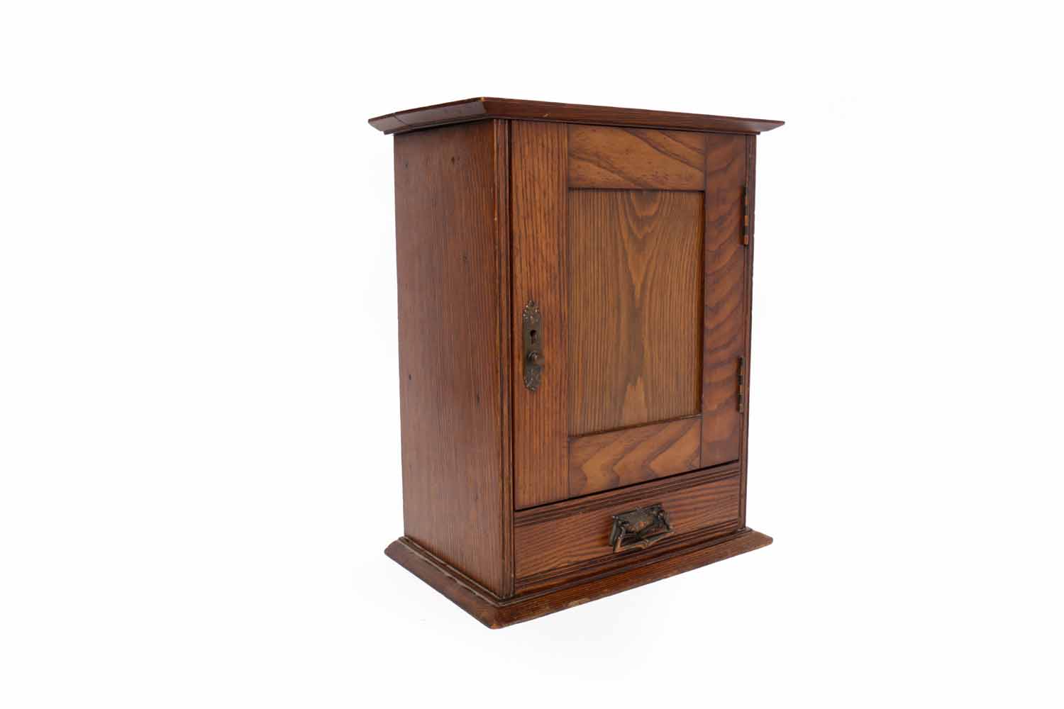 20TH CENTURY OAK TOBACCO CABINET the panelled hinged door and lid enclosing a shelf for tobacco jar