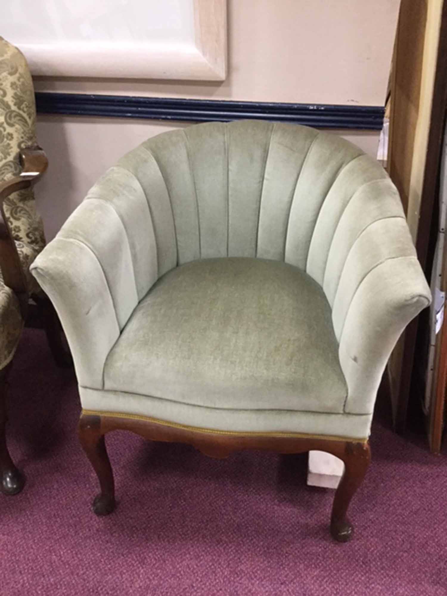 MAHOGANY FRAMED SHELL-BACKED TUB CHAIR IN THE ART DECO STYLE upholstered in pale green velour,