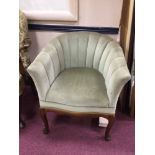 MAHOGANY FRAMED SHELL-BACKED TUB CHAIR IN THE ART DECO STYLE upholstered in pale green velour,