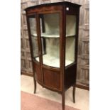 EDWARDIAN MAHOGANY 'SHERTON REVIVAL' BOW FRONT DISPLAY CABINET two shelves enclosed by two galzed