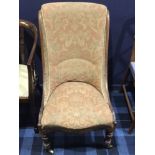 VICTORIAN ROSEWOOD NURSING CHAIR rear legs cabriole, front legs turned and with wheels,