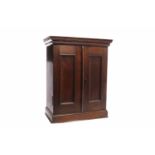 19TH CENTURY MAHOGANY SMALL CABINET with stepped pediment above two fielded doors enclosing a