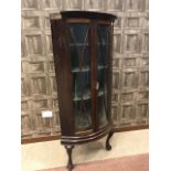 19TH CENTURY BOW FRONT CORNER CABINET ON LATER STAND the shelved interior enclosing by two astragal