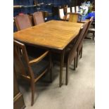 MID-20TH CENTURY G-PLAN TEAK DINING ROOM SUITE comprising an extending table,