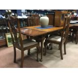 COMPOSED MAHOGANY AND WALNUT DINING SUITE comprising draw leaf table, rectangular sideboard,