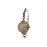 LADY'S EARLY TWENTIETH CENTURY BENSON NINE CARAT GOLD WRIST WATCH the round dial with J.W.