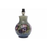 MOORCROFT 'ANEMONE' PATTERN LAMP BASE tube-lined with pink and blue flowers on a mottled green-blue