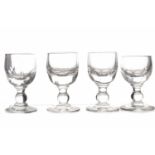 SEVEN REGENCY CORDIAL GLASSES each with small ovoid faceted bowl, single knop stem and plain foot,