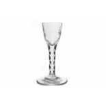 LATER 18TH CENTURY WINE GLASS with round funnel bowl engraved with six petal flower and buds,