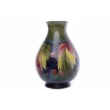 MOORCROFT 'LEAF AND BERRY' BALUSTER VASE circa late 1920s,